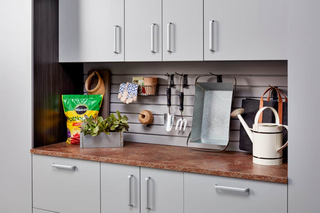 garage workspace with cabinets and drawers