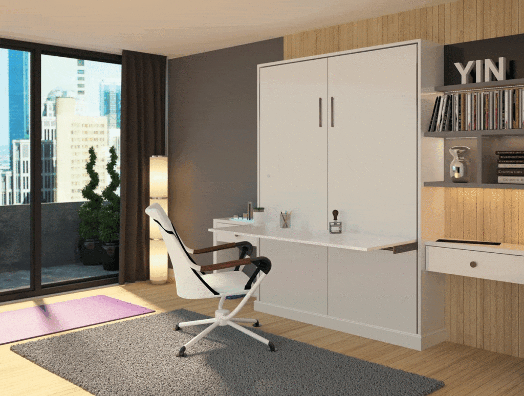 A modern home office with a murphy bed folding down over a desk, white chair, closet storage shelves with books, and a view of the city through sliding glass doors. Closet Concepts of Grand Rapids
