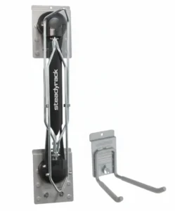 Two wall-mounted bike racks: one vertical Steadyrack with a black center panel, and one smaller silver hook rack, both attached to a white wall. Closet Concepts of Grand Rapids